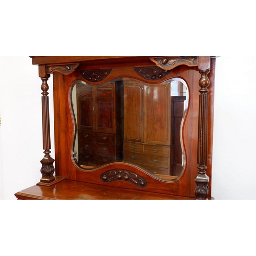 1279 - An Art Nouveau mirror back sideboard with ornately carved decoration of interwined stems and buds