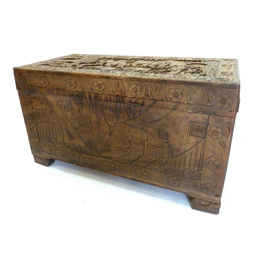 1283 - A carved Chinese camphorwood chest