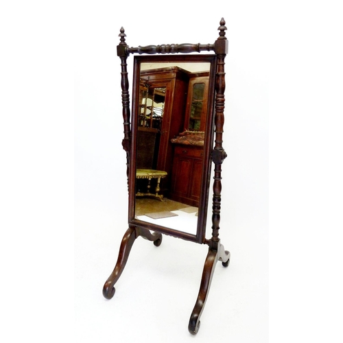 1291 - A Victorian mahogany cheval mirror on turned supports