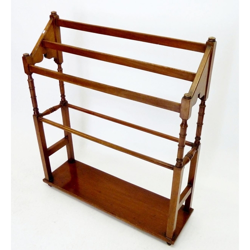 1296 - A Victorian mahogany towel rail on turned supports