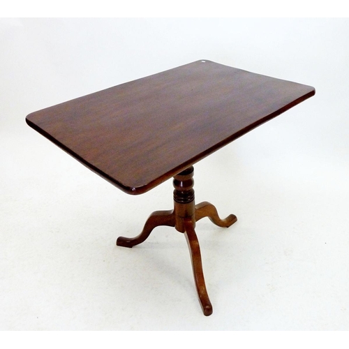 1299 - A 19th mahogany tilt top rectangular occasional table on turned column and triple cabriole supports