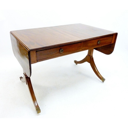 1303 - A mid 20th century mahogany sofa table, 104 (centre top) x 66cm