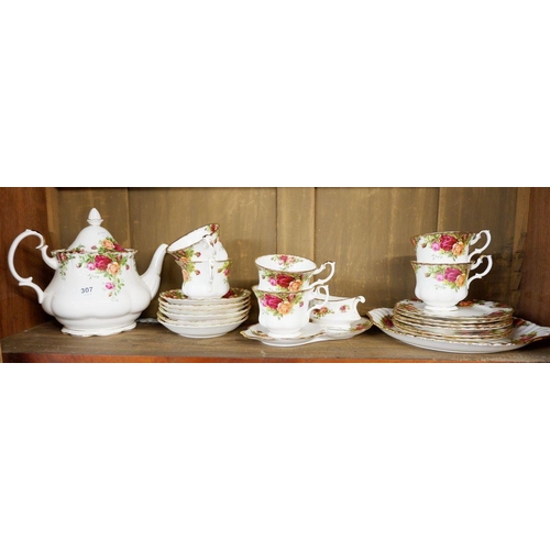 307 - A Royal Albert 'Country Roses' tea service comprising: teapot, six cups and saucers, six tea plates ... 