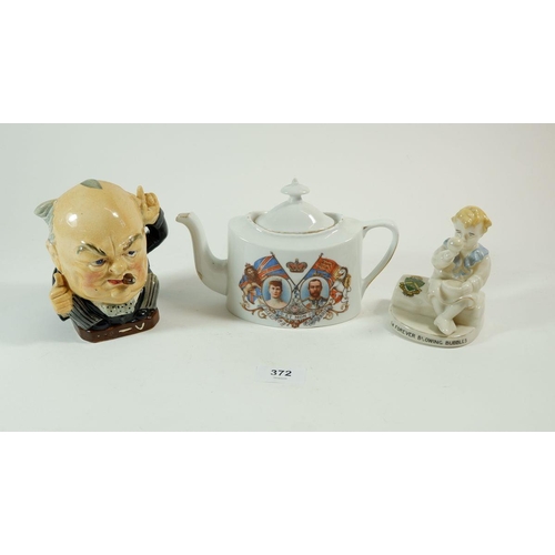 372 - A Churchill Toby jug, a Carlton Bubbles figure and a commemorative teapot