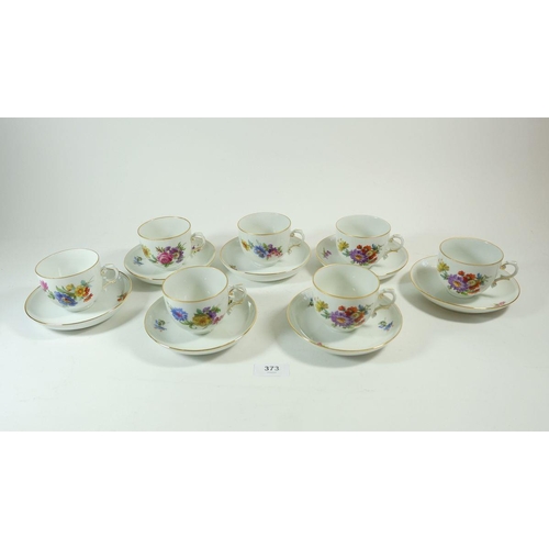 373 - A floral painted set of seven tea cups and saucers