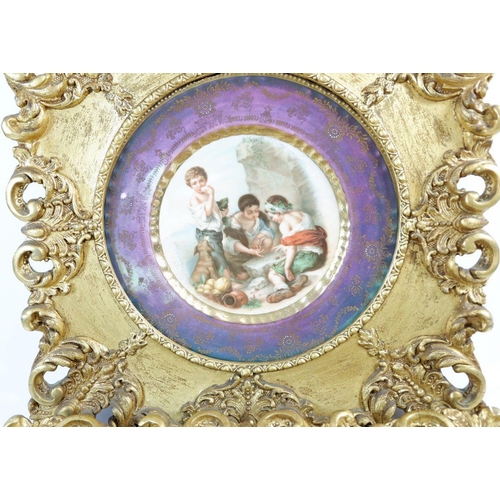 444 - A pair of gilt framed prints after Murillo on porcelain, 24cm diameter