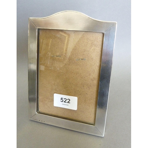 522 - A silver photograph frame, 18 x 12.5cm