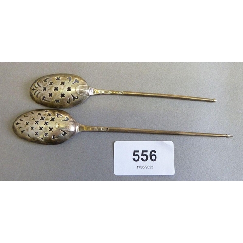 556 - A Georgian mote spoon with 'RH' makers mark 13 cm, another mote spoon 14.5 cm, a trinket dish Birmin... 