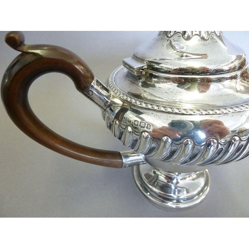 571 - A silver three piece tea service with gadrooned border and pedestal foot, Sheffield 1898 Jenkins & T... 