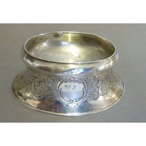 572 - A silver oval trencher salt pot with engraved scrolling foliage, London 1739