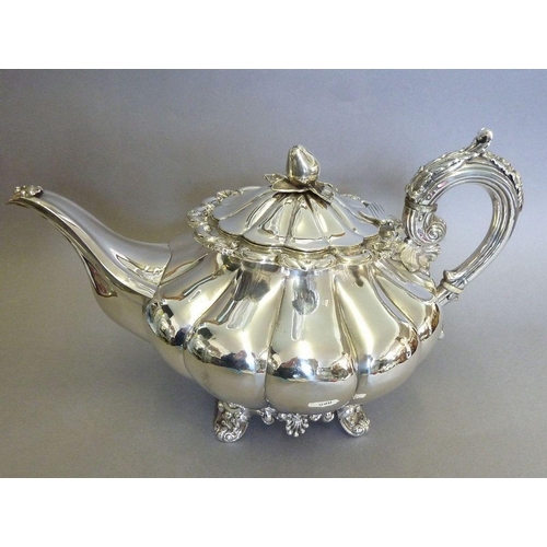 586 - An Irish silver teapot of melon form with fruit finial, Dublin 1839 by Robert Smith 865g