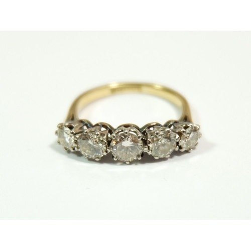 600 - An 18 carat gold and platinum set five stone diamond ring, approx 1.4 carats of diamonds, size M, 3.... 