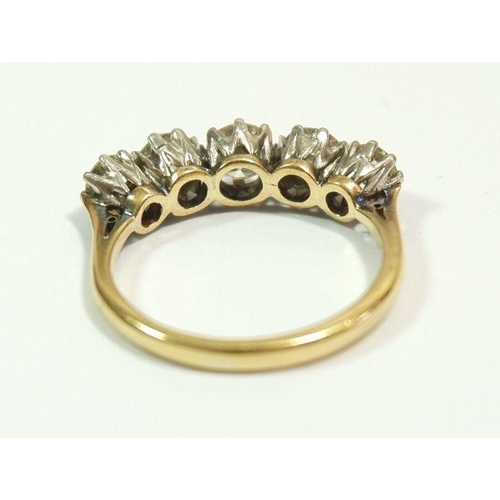 600 - An 18 carat gold and platinum set five stone diamond ring, approx 1.4 carats of diamonds, size M, 3.... 