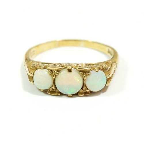 606 - A 9 carat gold ring set three opals, size Q