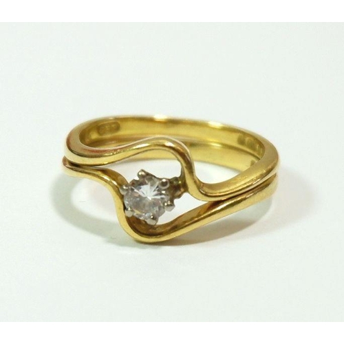 611 - A 1970's 18 carat gold interlinking wedding ring and engagement solitaire diamond ring, size K, 4.2g... 