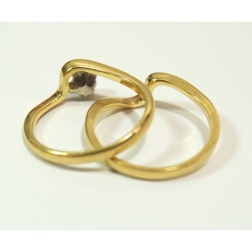 611 - A 1970's 18 carat gold interlinking wedding ring and engagement solitaire diamond ring, size K, 4.2g... 