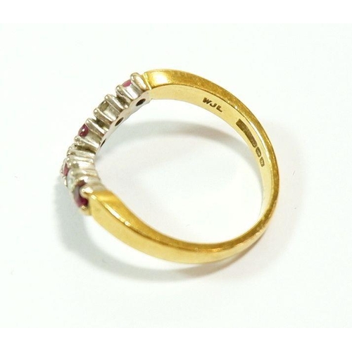 627 - An 18 carat gold ruby and diamond wishbone ring, size K