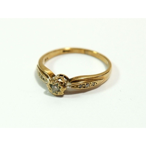 628 - A 9 carat gold ring illusion set diamond on chip diamond shoulders, size L to M