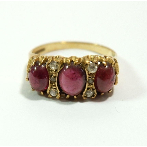 637 - A 9 carat gold ring set three cabochon cut pink stones and six white stones, size S to T