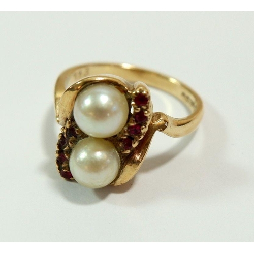 638 - A 9 carat gold ring set two seed pearls and small rubies, size M to N