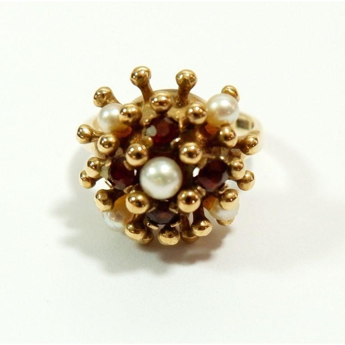 640 - A 9 carat gold vintage dome ring set garnets and pearls, size H, 4.5g