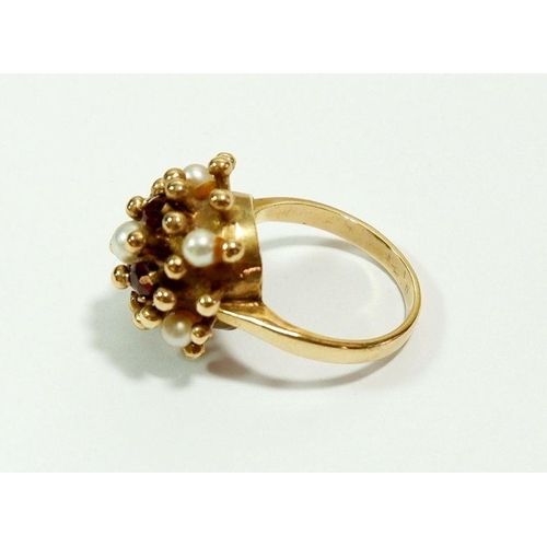 640 - A 9 carat gold vintage dome ring set garnets and pearls, size H, 4.5g