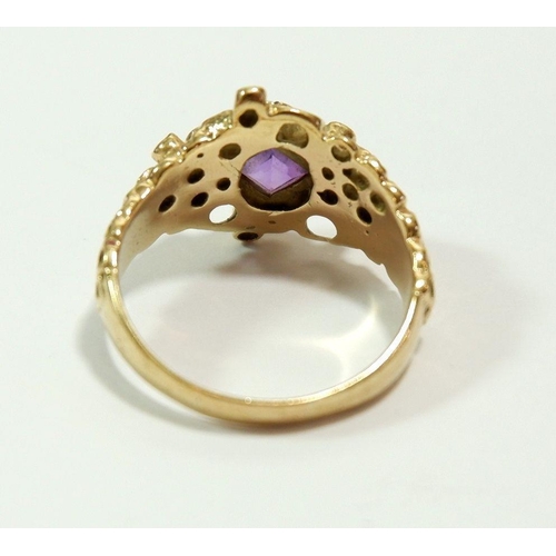 654 - A 9 carat gold ring set amethyst in 'pitted' setting, size Q, 5.4g