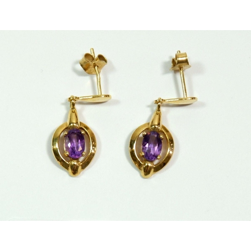 664 - A pair of 9 carat gold and amethyst earrings