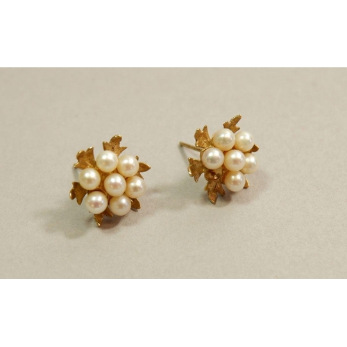 670 - A pair of gold cluster pearl earrings (one pearl missing)