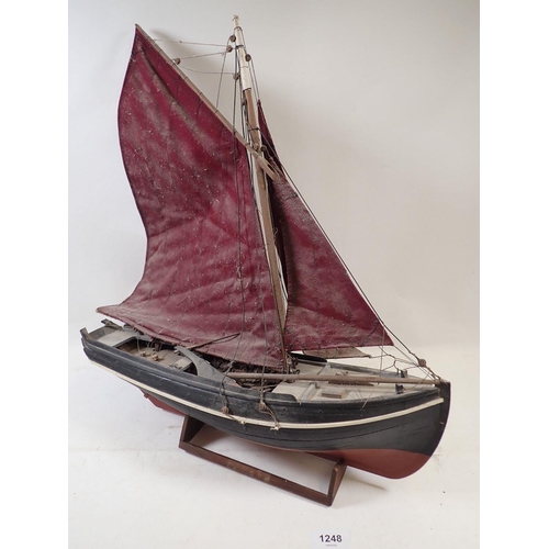 1248 - A model boat of a Galway Hooker (used for peat in Ireland) in need of restoration, 44cm long x 50cm ... 