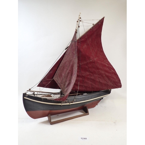 1248 - A model boat of a Galway Hooker (used for peat in Ireland) in need of restoration, 44cm long x 50cm ... 