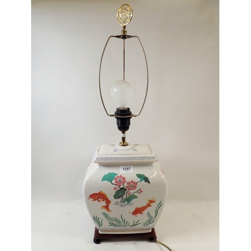 1257 - A Chinese table lamp painted golden carp, 28cm high