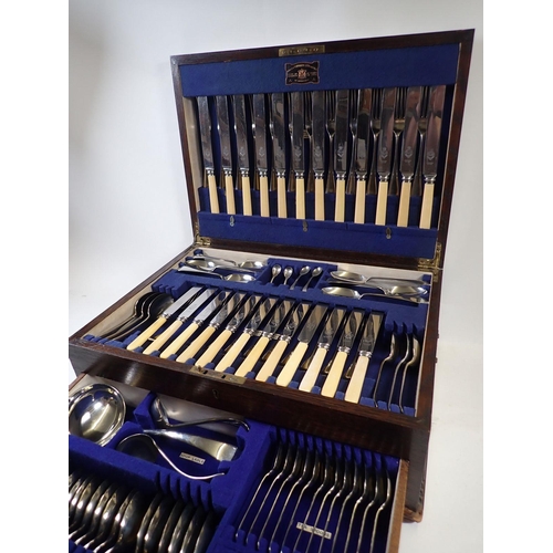 510 - A Viners twelve place setting silver plated cutlery set in fitted oak case