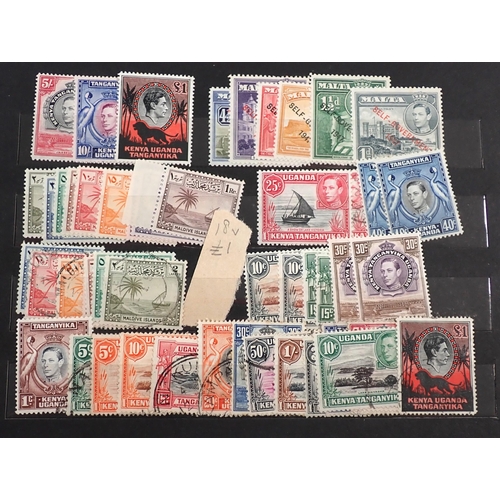 115 - Br Empire/C'wealth: Small maroon stock-book of mainly mint KGVI stamps, some in sets/part-sets to th... 