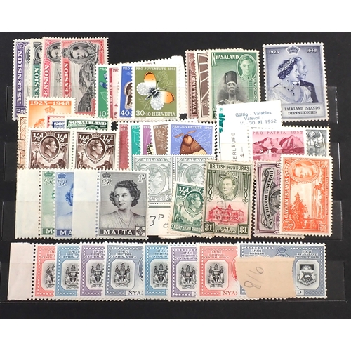 115 - Br Empire/C'wealth: Small maroon stock-book of mainly mint KGVI stamps, some in sets/part-sets to th... 