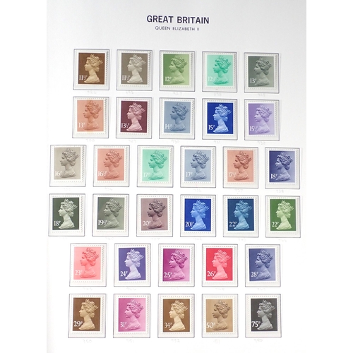 128 - GB: SG purposed dark blue album in sleeve of QEII mint defin, commem, postage due & regionals - most... 