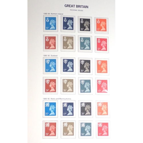 128 - GB: SG purposed dark blue album in sleeve of QEII mint defin, commem, postage due & regionals - most... 