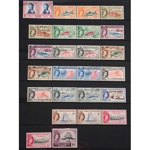 165 - Turks & Caicos Is: Black 14 page Hagner album of QV-QEII defin & commem. Wmk, overprint & other vari... 