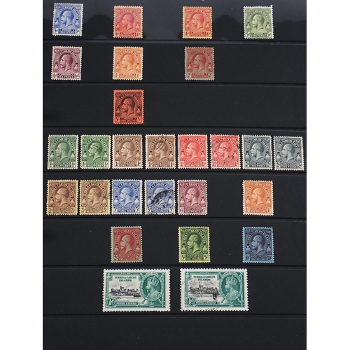 165 - Turks & Caicos Is: Black 14 page Hagner album of QV-QEII defin & commem. Wmk, overprint & other vari... 