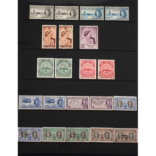 165 - Turks & Caicos Is: Black 14 page Hagner album of QV-QEII defin & commem. Wmk, overprint & other vari... 