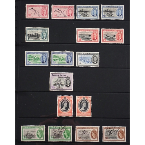 165 - Turks & Caicos Is: Black 14 page Hagner album of QV-QEII defin & commem. Wmk, overprint & other vari... 