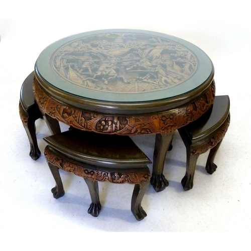 1002 - A Chinese circular occasional table and 4 1/4 nest tables all with elaborate carved decoration