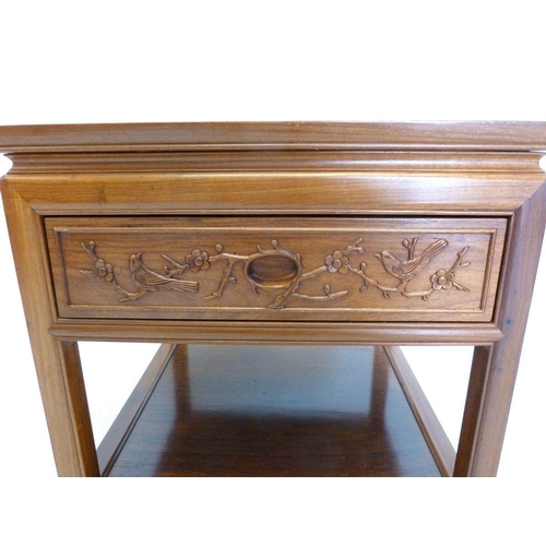 1004 - A Chinese square two tier occasional table with drawer carved birds and prunus, 56cm square