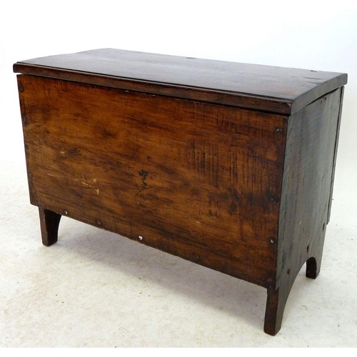 1005 - An antique small elm coffer on stile supports, 60cm wide