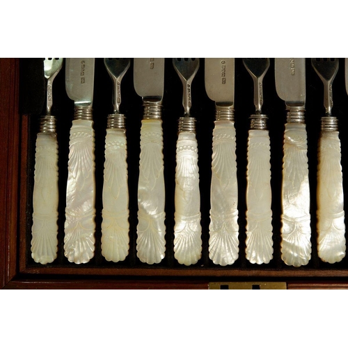 197 - A boxed set of twelve pairs of silver fruit knives and forks with mother of pearl handles, Sheffield... 