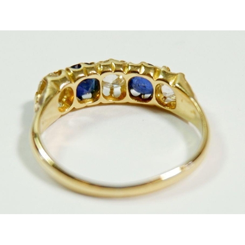 238 - An 18 carat gold five stone sapphire and diamond ring (approx. total 1.5cts diamonds), size R, 4g