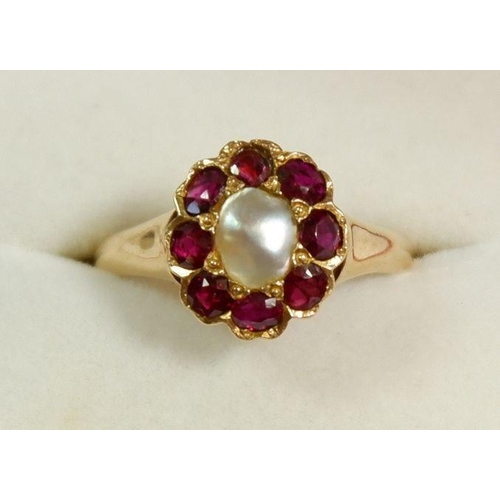 246 - An 18 carat gold ruby and pearl cluster ring 12 x 11mm, size Q to R, 4g