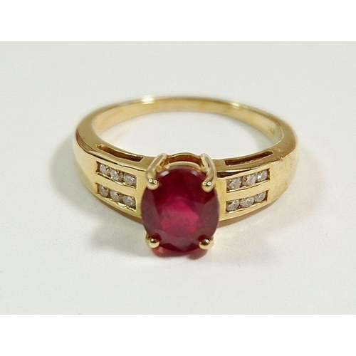 250 - A 14 carat gold ring set ruby on diamond set shoulders,