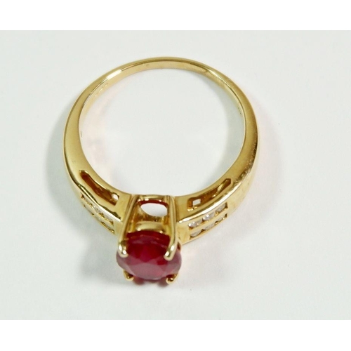 250 - A 14 carat gold ring set ruby on diamond set shoulders,