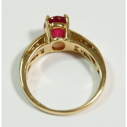 250 - A 14 carat gold ring set ruby on diamond set shoulders,